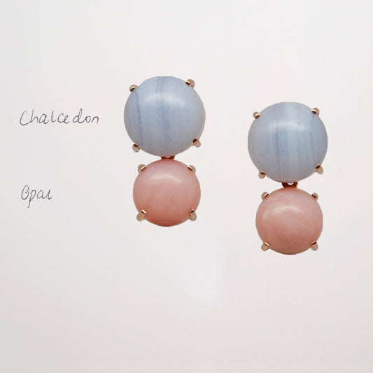 Chalcedony and Pink Opal as a pair of pink and blue gemstone earrings on white background set in rose gold